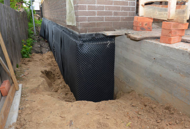 Happy homeowners after waterproofing job in Brielle